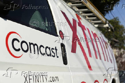 FILE PHOTO: A Comcast sign is shown on the side of a vehicle in San Francisco