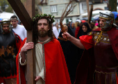 Members of the Italian community take part in a re-enactment of the crucifixion of Jesus Christ on Good Friday in Bensheim