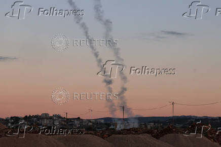 Israel's Iron Dome anti-missile system operates for interceptions as projectiles are launched from Lebanon towards Israel