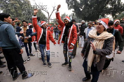 Pakistan's Christian minority dressed up as Santa hold rally in Peshawar