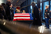 Mourners view the casket of former President Jimmy Carter as he lies in repose at the Jimmy Carter Presidential Library and Museum in Atlanta