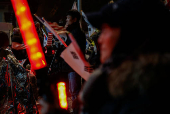 Pro-Yoon protesters are seen in the early light after rallying throughout the night in support of impeached South Korean President Yoon Suk Yeol near his official residence, in Seoul