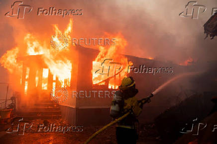 Palisades Fire burns during a windstorm on the west side of Los Angeles