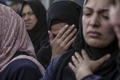 Palestinians mourn their dead at Deir Al Balah hospital after Israeli airstrike in central Gaza