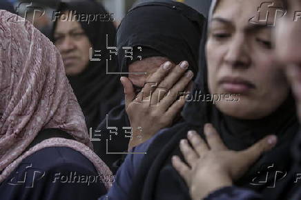 Palestinians mourn their dead at Deir Al Balah hospital after Israeli airstrike in central Gaza