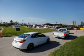 Volunteers hand out food care packages after Hurricane Helene passed through the Florida panhandle, in Perry