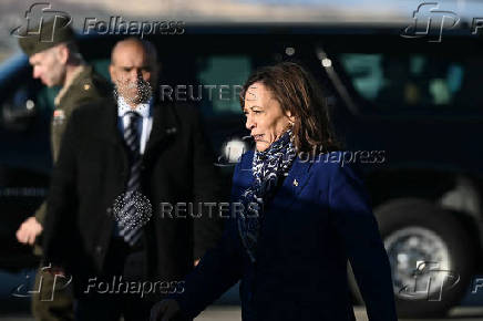 U.S. Vice President and Democratic presidential candidate Kamala Harris walks to her motorcade upon arrival at Reno-Tahoe International Airport in Reno