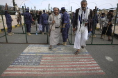 Houthi supporters protest againt the US and Israel in Sana'a