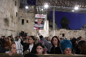 Hostages' families participate in lighting of first Hanukkah candle at Western Wall in Jerusalem