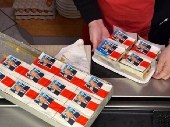 Ursula Trump presents pastries decorated with an eatable portrait of U.S. President-elect Donald Trump in a bakery in Freinsheim