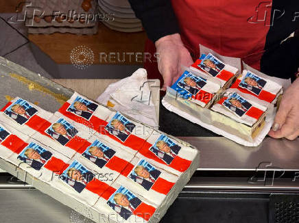 Ursula Trump presents pastries decorated with an eatable portrait of U.S. President-elect Donald Trump in a bakery in Freinsheim