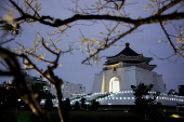 Chiang Kai-shek Memorial Hall stands as plum blossoms in Taipei