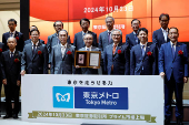 Akiyoshi Yamamura, President of Tokyo Metro, holds an IPO certificate at a ceremony to mark the company's debut on the Tokyo Stock Exchange in Tokyo