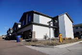 Investigators search a townhouse, in relation to the explosion in Las Vegas of a Tesla Cybertruck