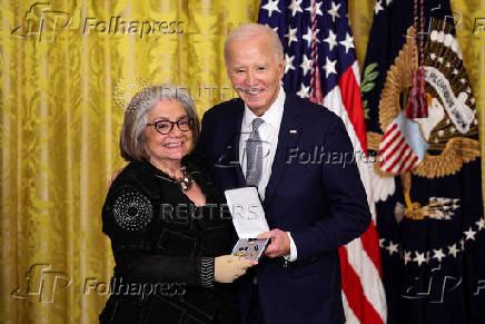 U.S President Biden gives the Presidential Citizens Medal, one of the country's highest civilian honors, during a ceremony at the White House in Washington