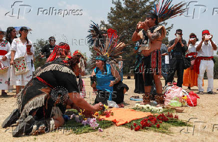 Members of Indigenous communities participate in rain petition rituals with songs and offerings, in the archaeological site of Cuicuilco