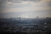 Smoke rises above Haifa after rockets were fired from Lebanon into Israel, amid cross-border hostilities between Hezbollah and Israel, in Haifa