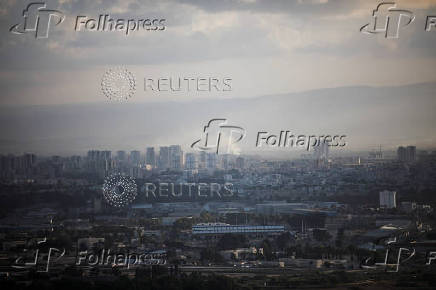 Smoke rises above Haifa after rockets were fired from Lebanon into Israel, amid cross-border hostilities between Hezbollah and Israel, in Haifa