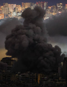 Smoke billows over Beirut's southern suburbs, after an Israeli strike