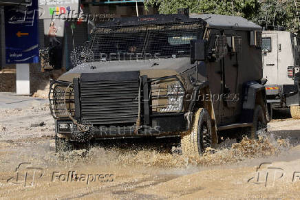Israeli military vehicle drives in Tulkarm