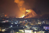 Smoke billows over Beirut's southern suburbs, as seen from Sin El Fil