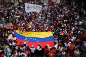 Government supporters participate in a march in support of Venezuelan President Nicolas Maduro?s victory in the July 28 elections, in Caracas