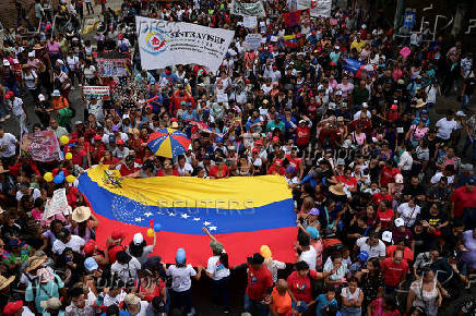 Government supporters participate in a march in support of Venezuelan President Nicolas Maduro?s victory in the July 28 elections, in Caracas