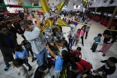 Migrants participate in a Posada ahead of Christmas, in Tijuana