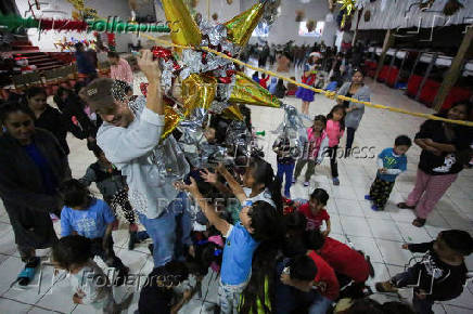 Migrants participate in a Posada ahead of Christmas, in Tijuana