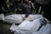 Palestinians mourn their dead at Deir Al Balah hospital after Israeli airstrike in central Gaza