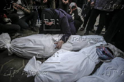 Palestinians mourn their dead at Deir Al Balah hospital after Israeli airstrike in central Gaza