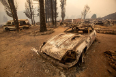 Cal Fire firefighters tackle the Bridge Fire threatening mountain communities near Los Angeles