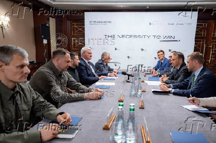 Ukraine's President Zelenskiy attends a meeting with Polish FM Sikorski and FM of Lithuania Landsbergis in Kyiv