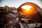 Firefighters hold the line against two massive wildfires in Los Angeles County