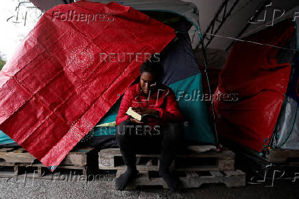 Asylum seekers wait at a temporary shelter for an opportunity to enter the U.S., in Matamoros