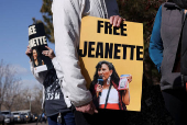 FILE PHOTO: People protest outside the Immigration and Customs Enforcement facility in Aurora