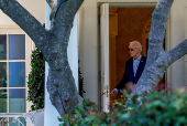 U.S. President Joe Biden walks out of the Oval Office as he departs the White House