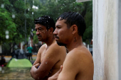 Migrant caravan stops to rest before moving on its way to the U.S.-Mexico border, in Escuintla