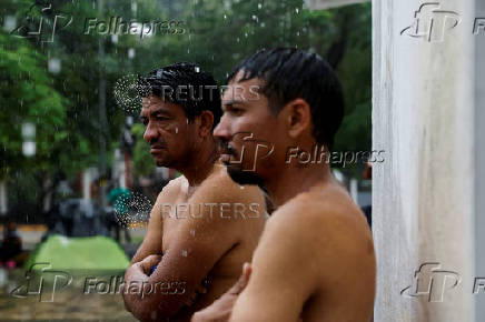 Migrant caravan stops to rest before moving on its way to the U.S.-Mexico border, in Escuintla