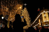 Paris Olympics chief Estanguet turns on Christmas lights on the Champs Elysees