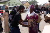 Boxes of supplies are distributed to the poor in Lagos