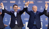 Turkish President Erdogan and mayoral candidate of his ruling AK Party Kurum pose during a campaign event ahead of the local elections in Istanbul