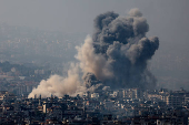 Smoke rises over Beirut's southern suburbs after a strike, amid ongoing hostilities between Hezbollah and Israeli forces