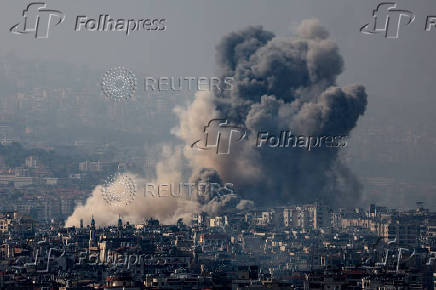 Smoke rises over Beirut's southern suburbs after a strike, amid ongoing hostilities between Hezbollah and Israeli forces