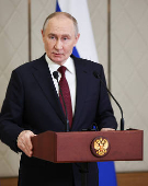 Russian President Putin attends a press conference in Astana