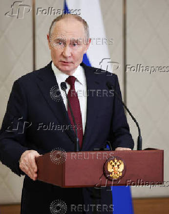 Russian President Putin attends a press conference in Astana