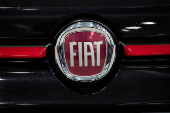 FILE PHOTO: The logo of Fiat is seen over a vehicle in a showroom in Milan