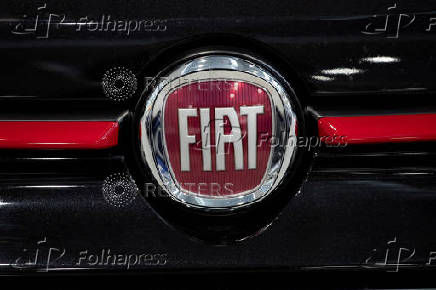 FILE PHOTO: The logo of Fiat is seen over a vehicle in a showroom in Milan