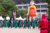 Players take part in the Red Light, Green Light game at Gelora Bung Karno Stadium ahead of the release of the Netflix series Squid Game: Season 2 in Jakarta