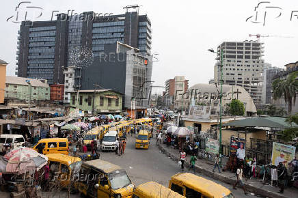 Commercial buses queue for passengers on Broad Street in Lagos